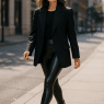 Fashion-savvy woman confidently wearing the best faux leather leggings in an urban street look