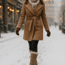 Fashion-savvy woman showcasing stylish best winter boots for snow in a snowy urban scene.