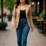 confident petite woman wearing best jeans for petite women walking stylishly outdoors