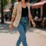 confident woman wearing best white sneakers for women walking stylishly in city streets