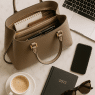 featured image of best work bags for women flat lay with laptop planner and accessories on marble table